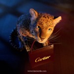 In the animated film, a cute panther cub and Cartier’s page boys deliver gifts to a home. Image: © Cartier