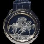 Hermès Arceau Pocket Chevaux Sauvages (wild horses). Introduced in 2014, the cover features the “wheel-engraved crystal” with two horses. Photo: © TANG Portfolio. Elfa / Timmy 2014