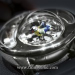 The songbird is the blue tit and it is housed in a protruding dome-shaped sapphire crystal at the 6 o’clock position. The bird can chirp (sing) three different notes of the melody and these are amplified by Jaquet Droz’s system. Photo: © TANG Portfolio. Elfa / Timmy BaselWorld 2015.