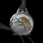 Slim d’Hermès Pocket Panthère. Introduced at the 2016 BaselWorld watch fair, this is a one-of-a-kind pocket watch featuring an engraved and enamelled white gold dial depicting a panther that is based on a painting by famed French wildlife artist Robert Dallet (1923 to 2006). Housed within its 45mm diameter white gold pocket watch case is the Hermès Manufacture Calibre H1950 automatic movement with 42 hours of power reserve. The case is water-resistant to 3 bar (30m) and comes with the pocket watch comes with a cord strap and pouch in matt havana leather. Photo: © TANG Portfolio. Elfa / Timmy. BaselWorld 2016.